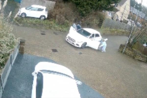 CCTV footage showed the moment the carjackers jumped in the white vehicle, pushing aside Lynn as her mother tried to intervene