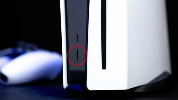 Image of a PS5's front with a circle around the power button