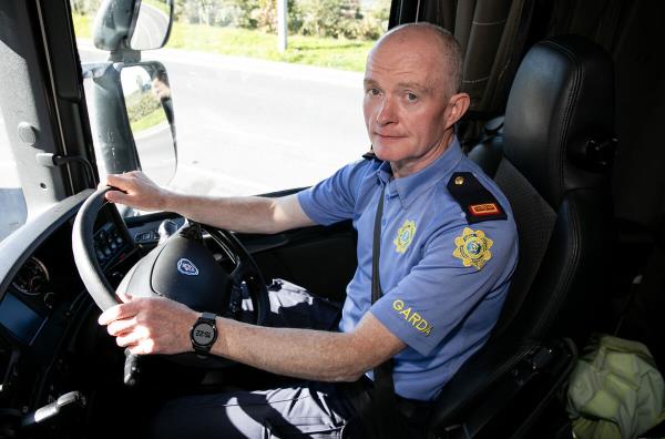 Inspector Peter Woods in the cab of the 'spotter' truck: 'The elevated position we have in the tractor unit of this HGV allows us to see into all forms of transport on the roads.'