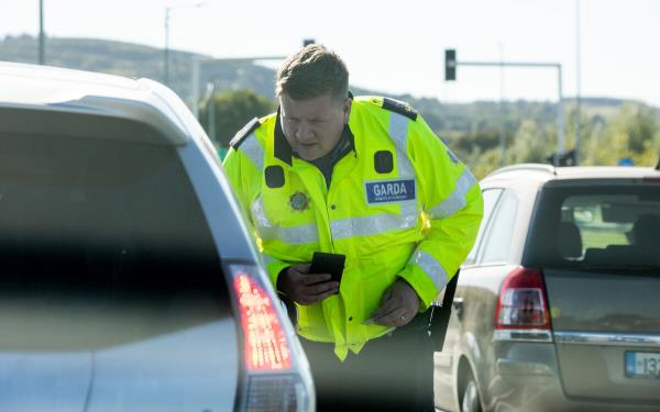 Sergeant Robert Griffin speaks to a motorist 'spotted' by the Garda HGV.